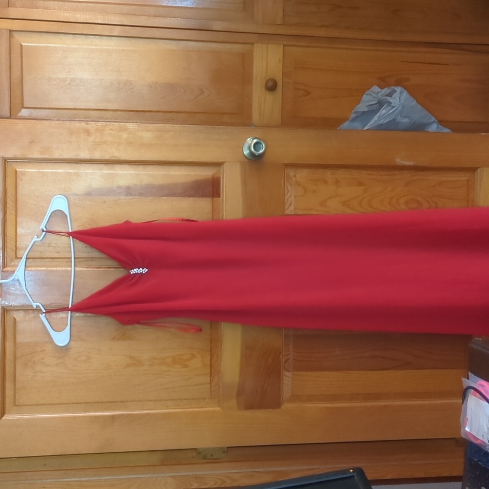 Red evening dress missing a rhinestone
